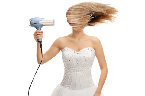 Hair stylist woman blow-drying hair in motion – Dettycated salon branding photo