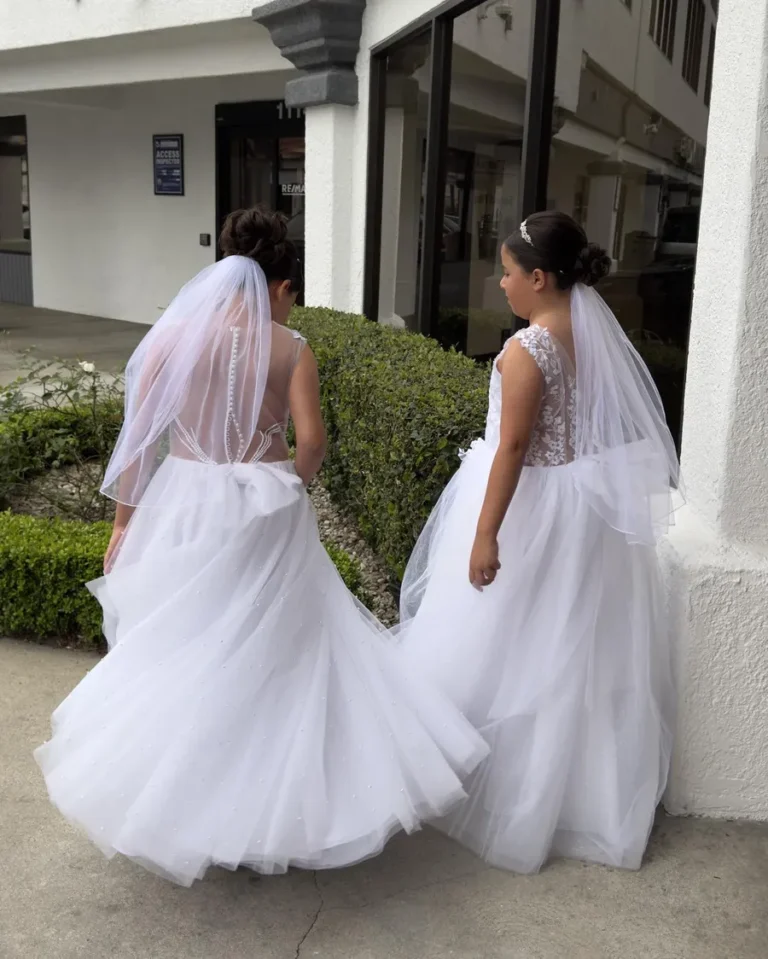 Dettycated flower girl hairstyles with elegant white dresses and veils for weddings or special occasions